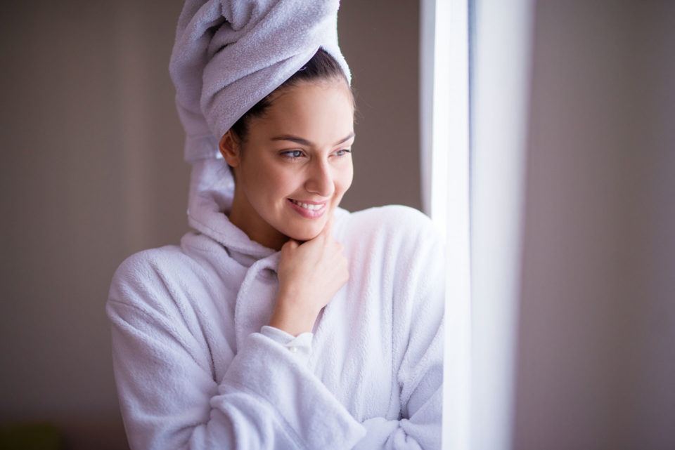 Elite Linen woman in robe and head wrapped in towel