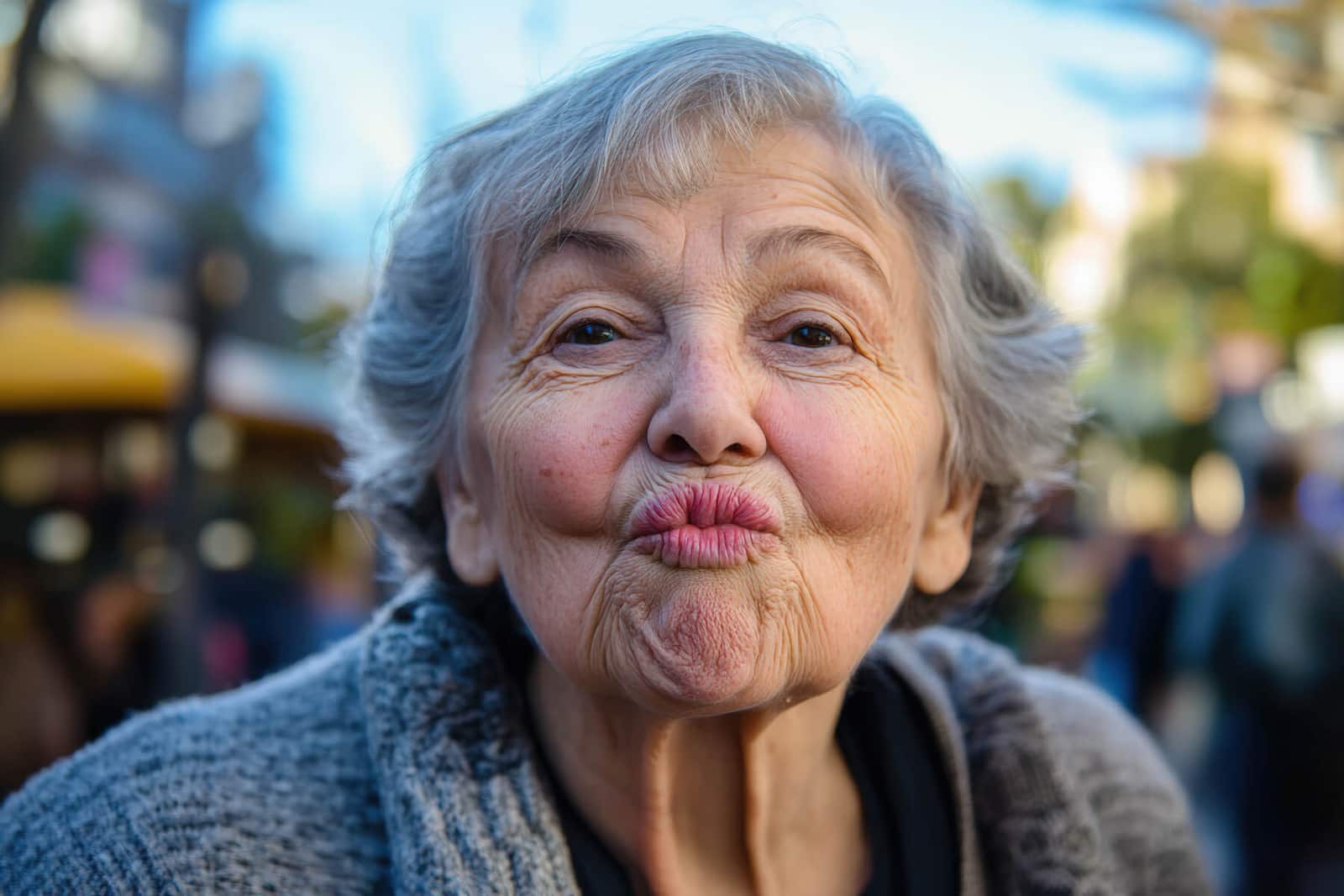 Senior woman blowing a kiss