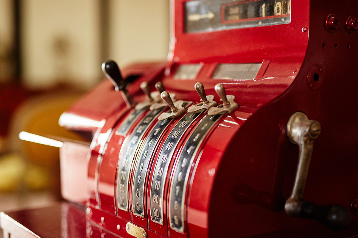 Red old-time cash register in a shop
